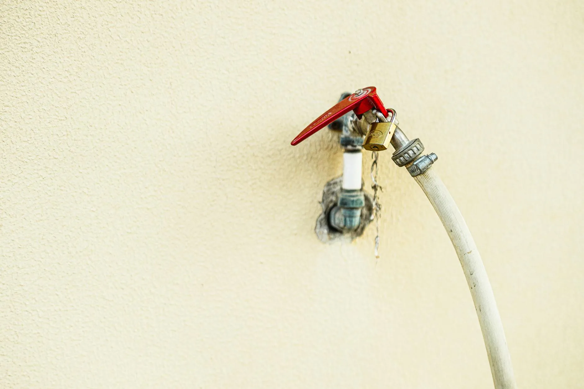 Outdoor garden tap with hose connector attached