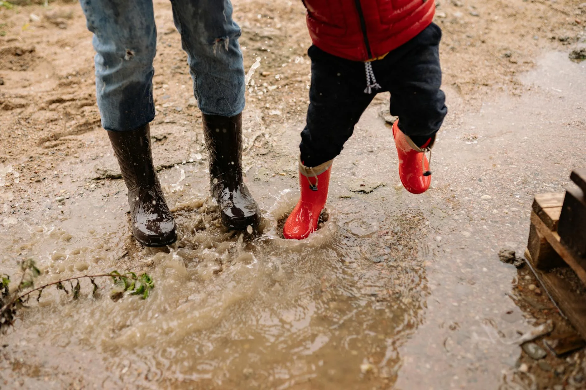 Muddy garden boots at a doorstep after outdoor work